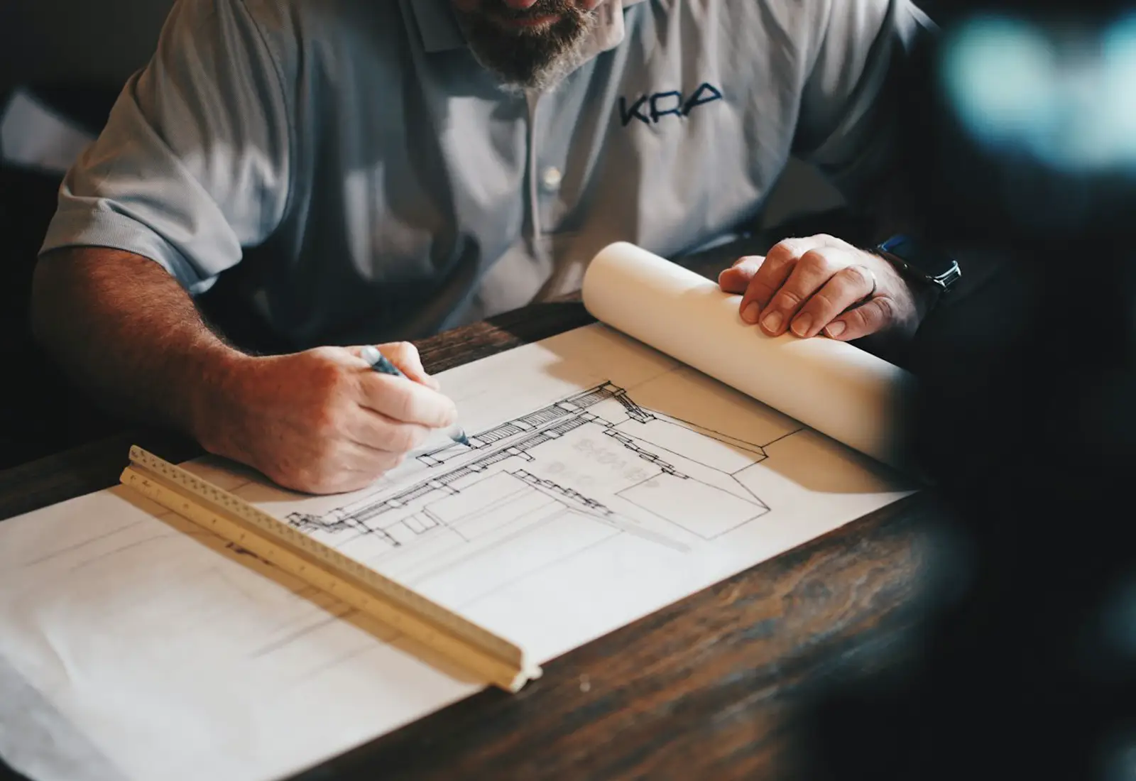 Illustrative photograph of an architectural model on a desk. Not a ULOT Construction project.